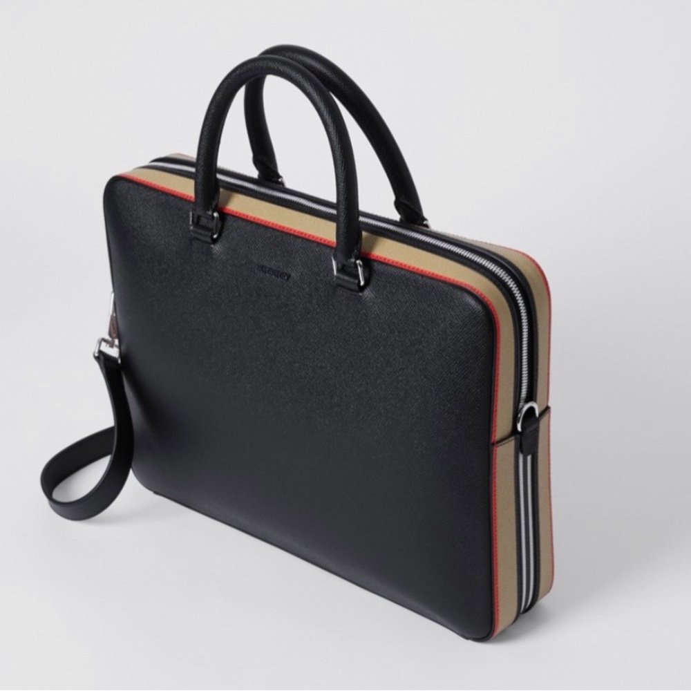 A compact briefcase in Italian-tanned grainy leather, detailed with icon strip